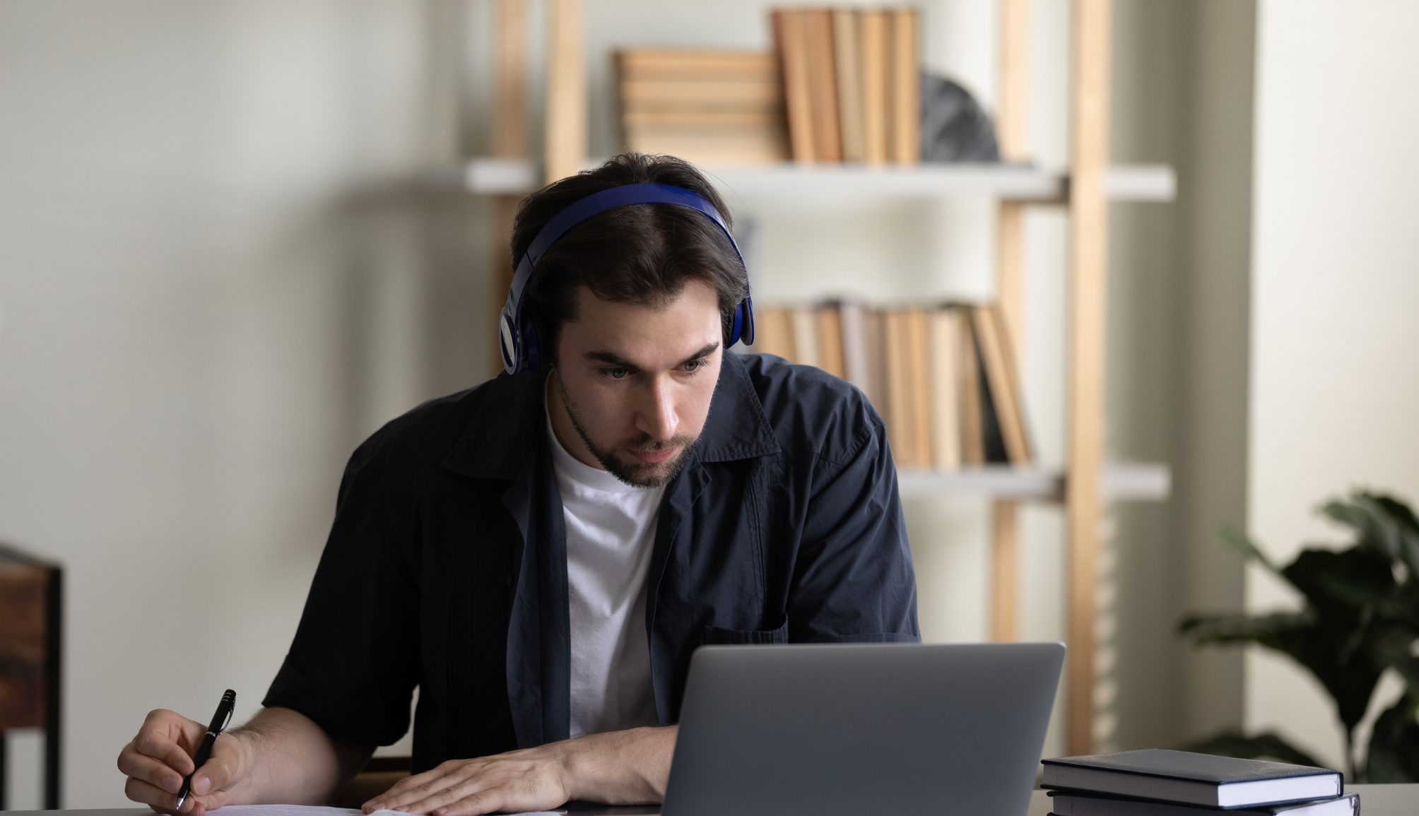 young-black-male-entrepreneur-working-with-laptop-2022-12-16-08-45-15-utc-min