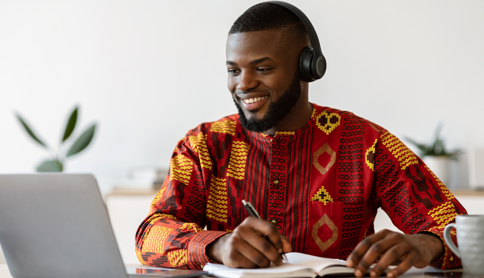 young-black-male-entrepreneur-working-with-laptop-2022-12-16-08-45-15-utc-min